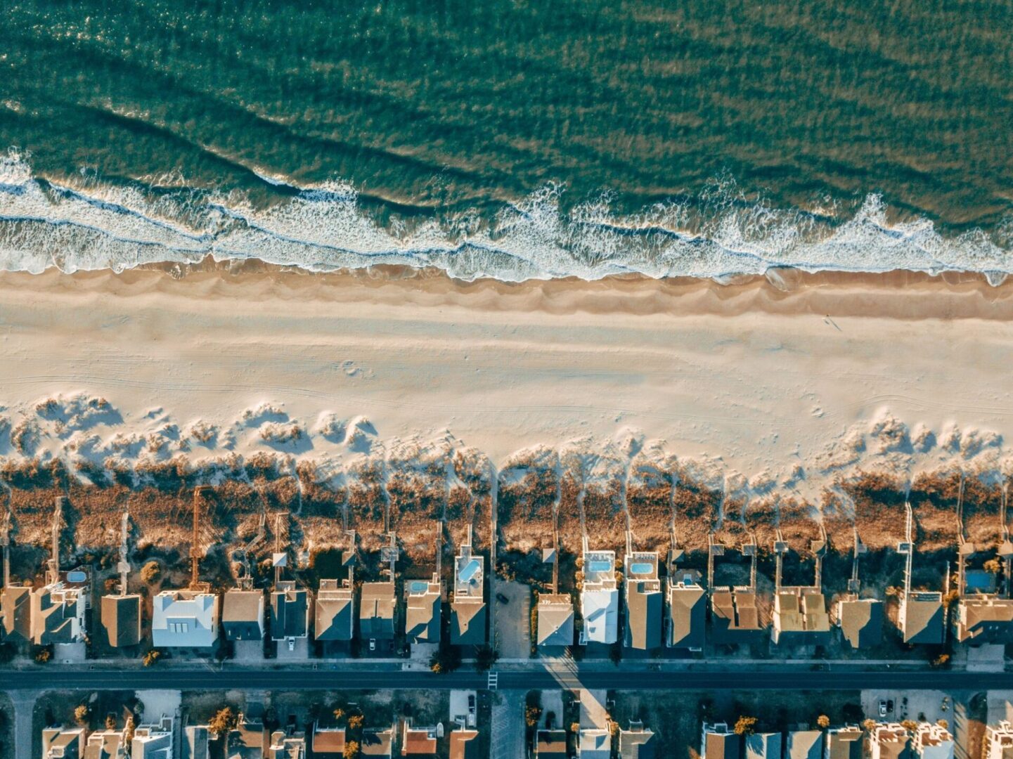 Coastal homes and ocean waves
